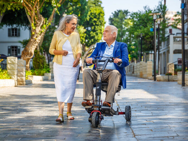 ATTO-Sport_Advert_man-on-scooter-with-lady-walking